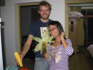 Our friend Thomas and his girlfriend shucking corn for a rare meal we made at home. We usually eat out and our fridge and cupboards are very empty. 