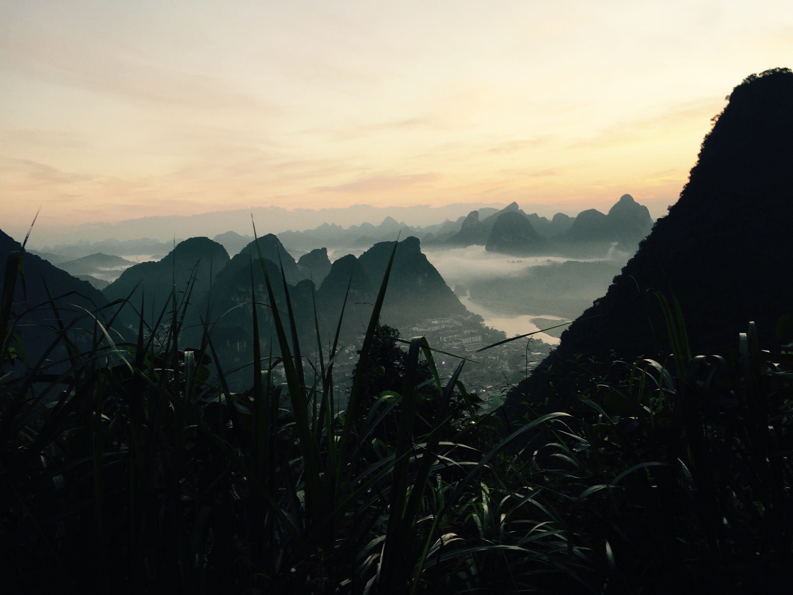 The summer is quite hot and humid, but the nights are a little cooler and in the morning, if you wake early enough, you can see the karst peaks shrouded in clouds. By the time the sun gets too high, they are already burned off.